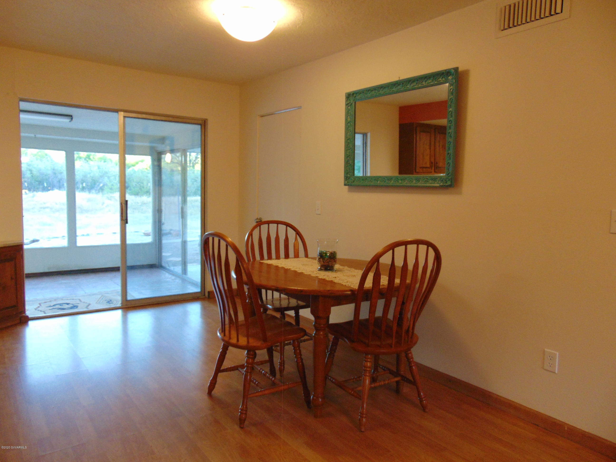 3548 East Rimrock Drive Rimrock, AZ 86335 - Photo 4 of 30 a view of a dining room with furniture and wooden floor