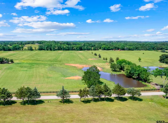 a view of a lake with a house in the background