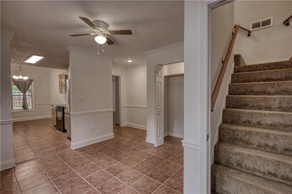 115 Huntington Street Covington, GA 30016 - Photo 24 of 77 a view of entryway and hall with a ceiling fan