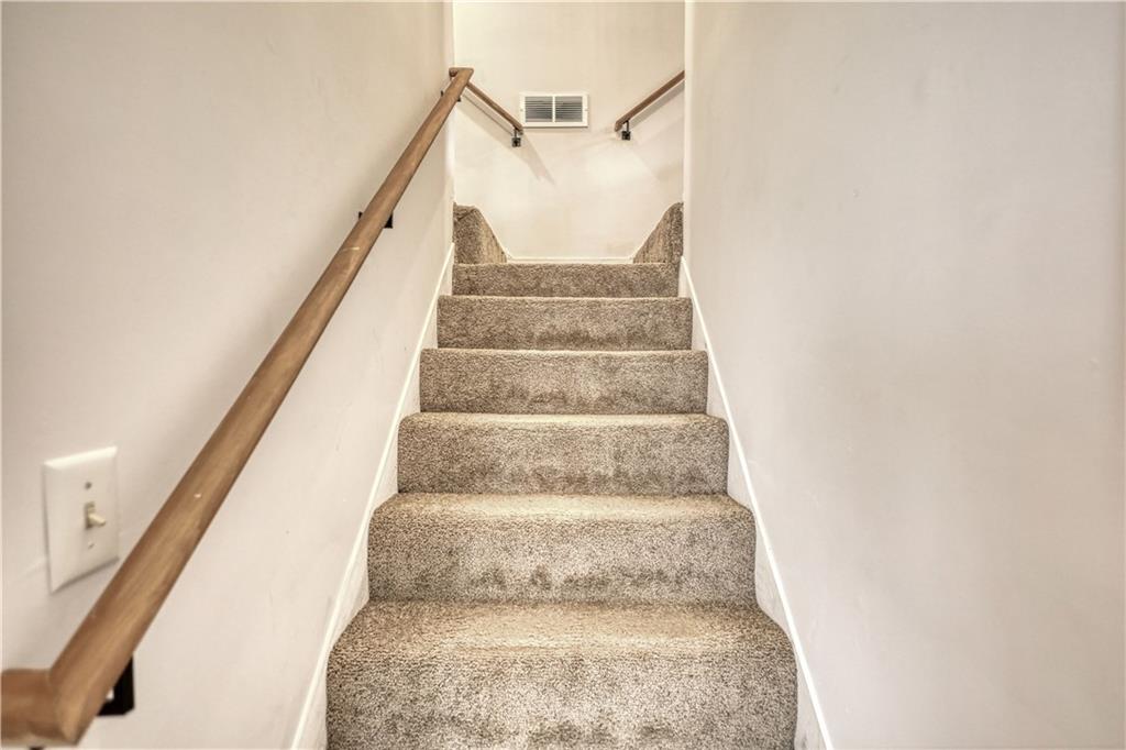115 Huntington Street Covington, GA 30016 - Photo 48 of 77 a view of staircase with white walls