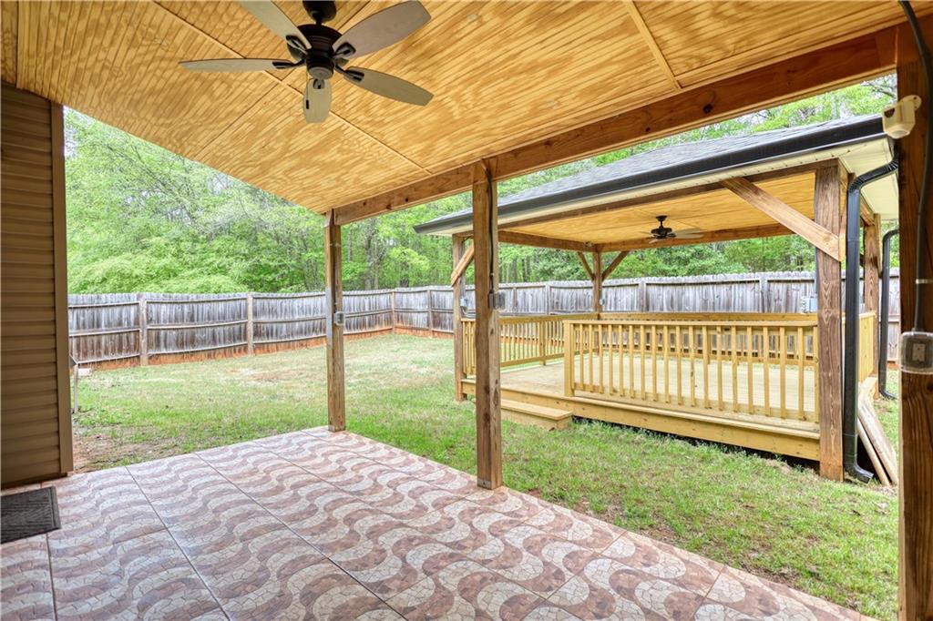 115 Huntington Street Covington, GA 30016 - Photo 55 of 77 a view of a porch with a backyard