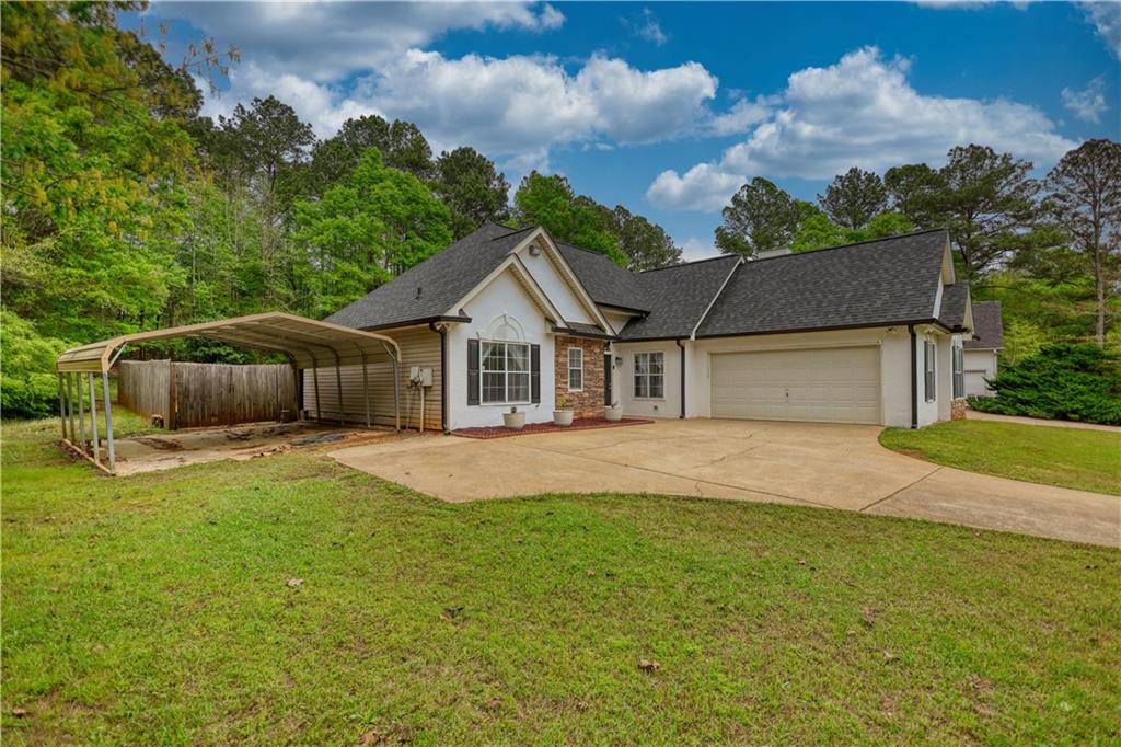 115 Huntington Street Covington, GA 30016 - Photo 68 of 77 a front view of a house with garden
