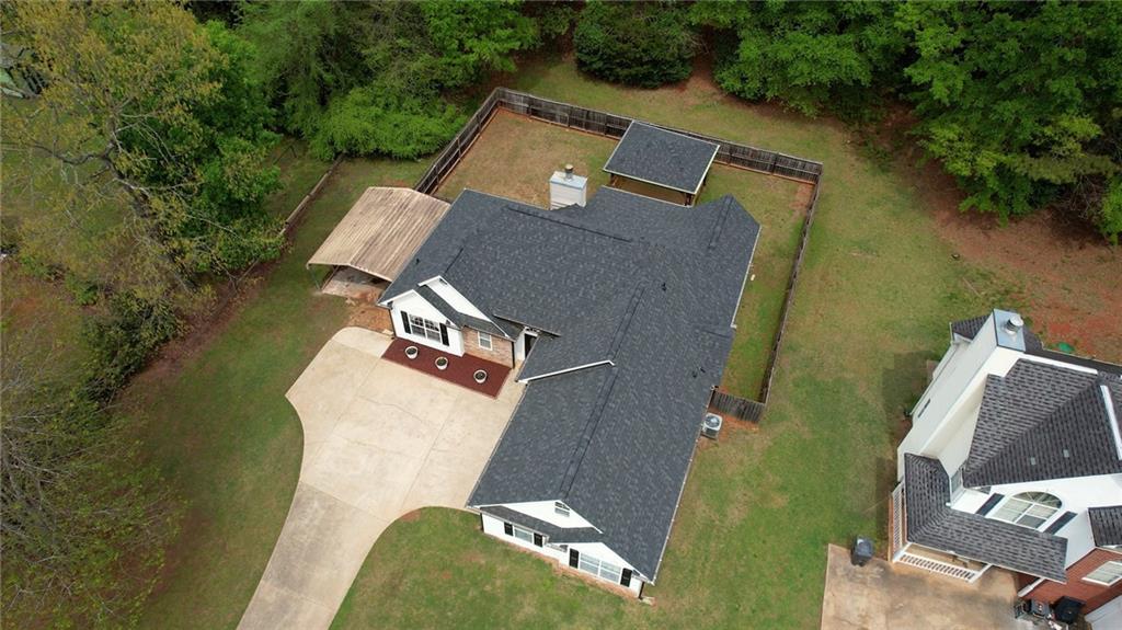 115 Huntington Street Covington, GA 30016 - Photo 69 of 77 an aerial view of a house with pool and yard