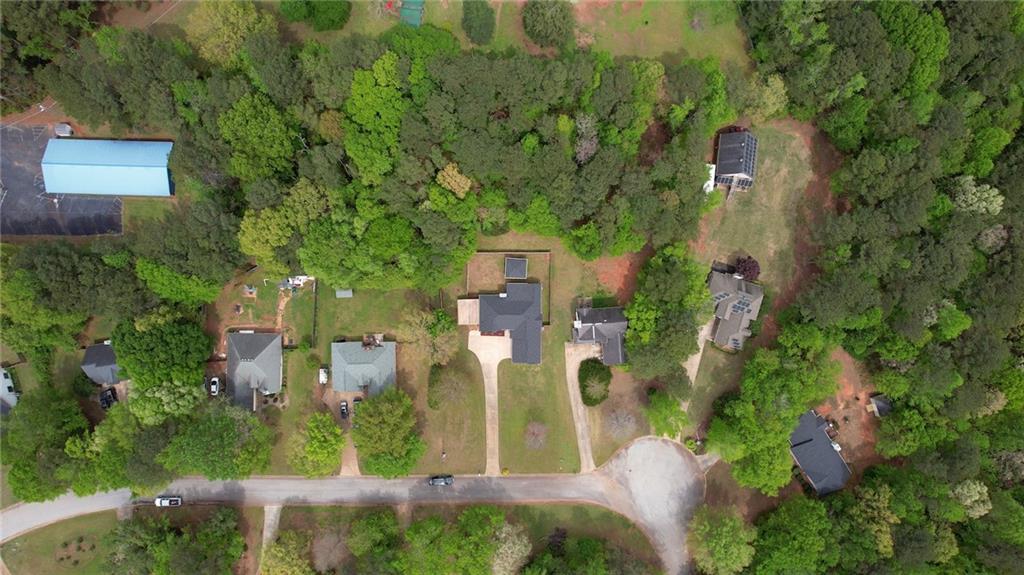 115 Huntington Street Covington, GA 30016 - Photo 73 of 77 an aerial view of residential houses with outdoor space and trees