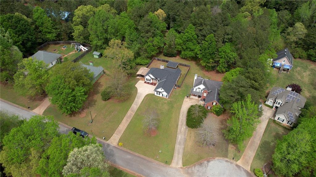 115 Huntington Street Covington, GA 30016 - Photo 74 of 77 an aerial view of residential house with outdoor space and swimming pool