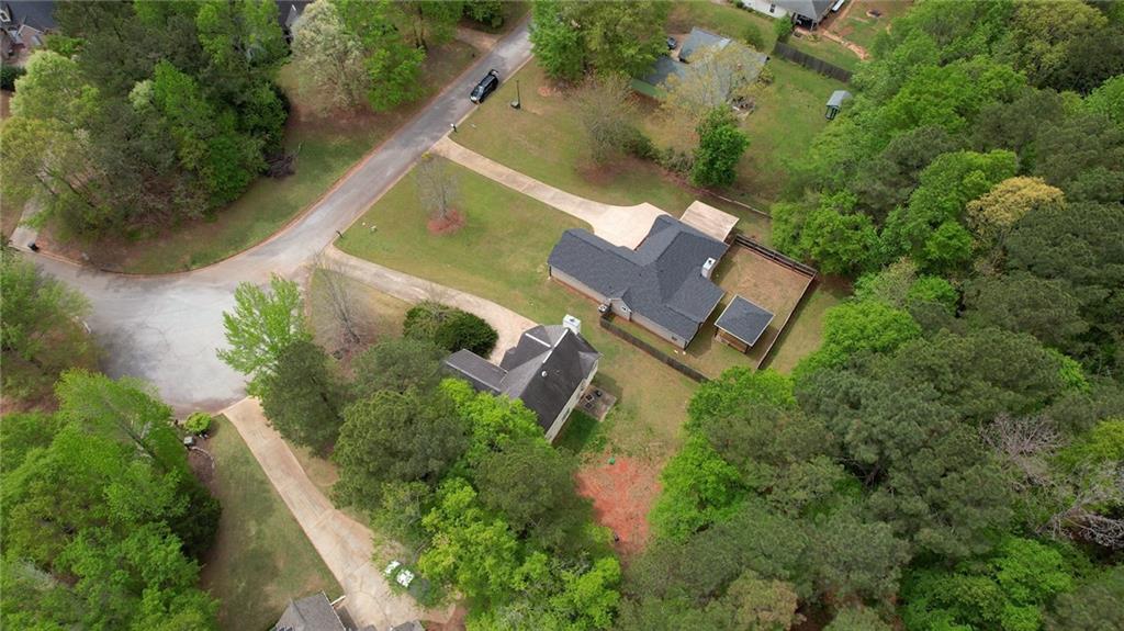 115 Huntington Street Covington, GA 30016 - Photo 76 of 77 an aerial view of a house with outdoor space and a lake view