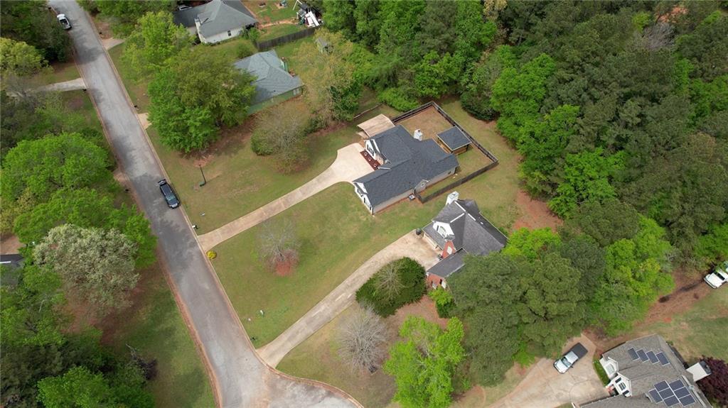 115 Huntington Street Covington, GA 30016 - Photo 77 of 77 an aerial view of a house with a yard