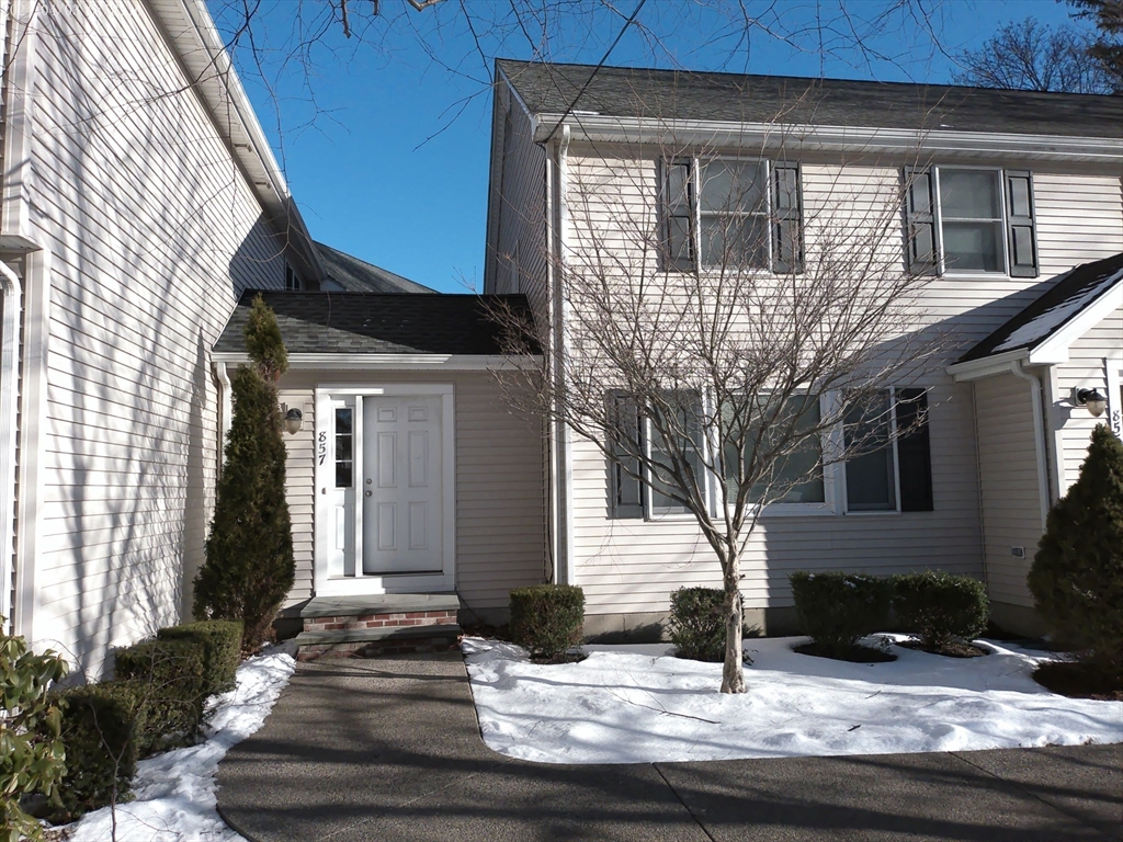 857 Washington Street, Unit 857 Canton, MA 02021 - Photo 2 of 17 a view of house with wooden door and outdoor space