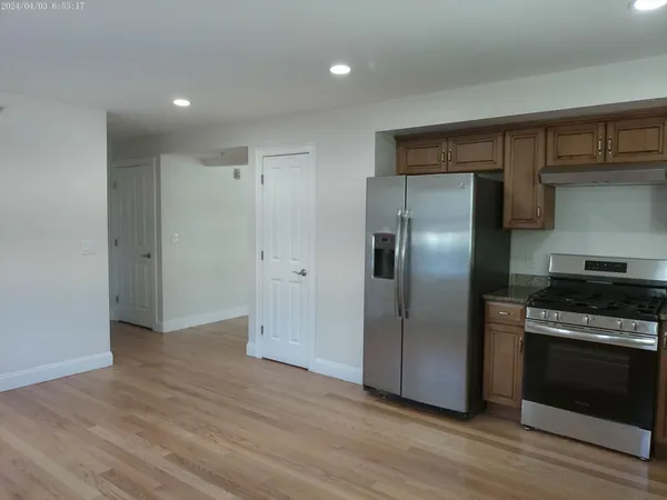 a large kitchen with a large window