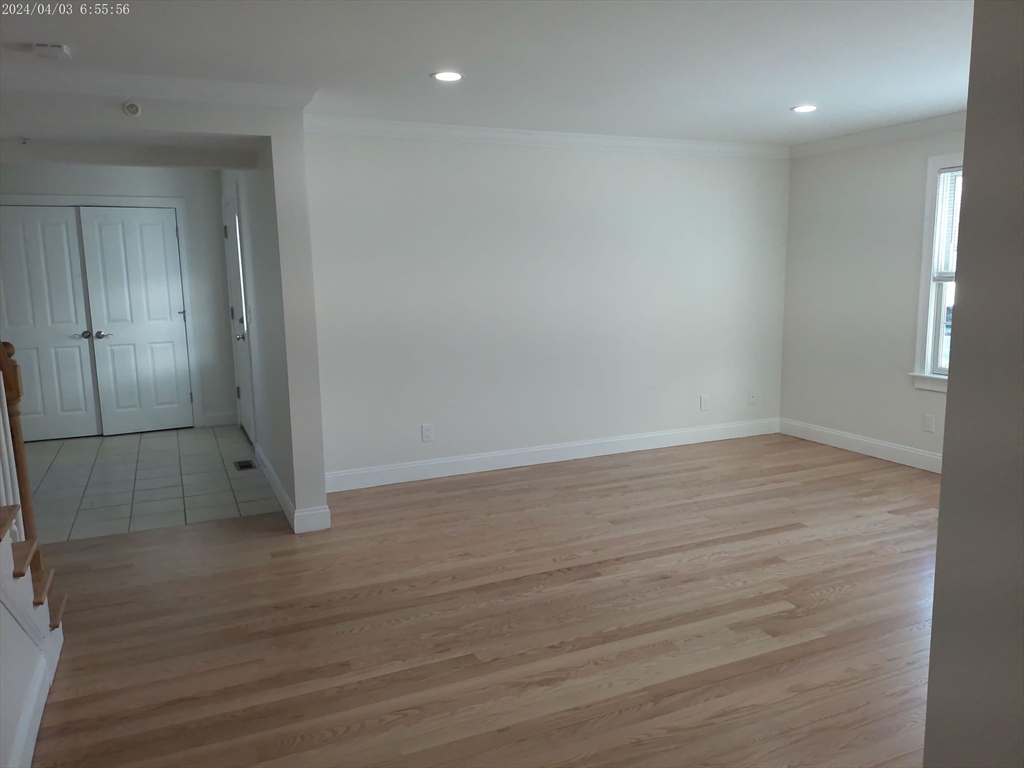 857 Washington Street, Unit 857 Canton, MA 02021 - Photo 7 of 17 wooden floor in an empty room