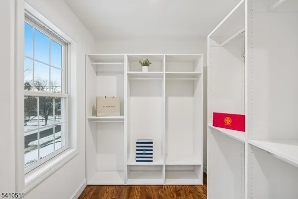 a view of an entryway with wooden floor