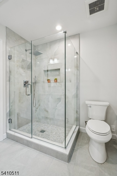 161 Myrtle Avenue Millburn, NJ 07041 - Photo 30 of 43 a bathroom with a shower a toilet and a sink