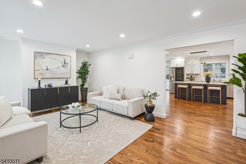 161 Myrtle Avenue Millburn, NJ 07041 - Photo 3 of 43 a living room with furniture wooden floor and kitchen view