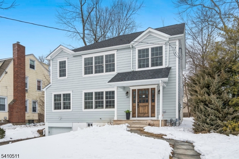 161 Myrtle Avenue Millburn, NJ 07041 - Photo 37 of 43 a front view of a house with a yard