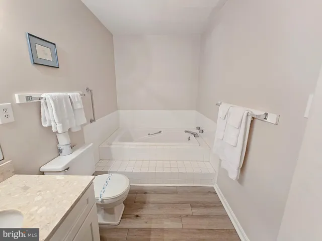 a bathroom with a bathtub and sink
