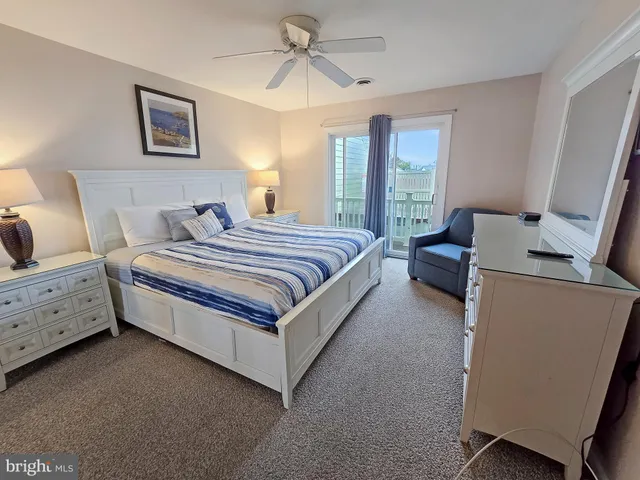 a spacious bedroom with a bed and window