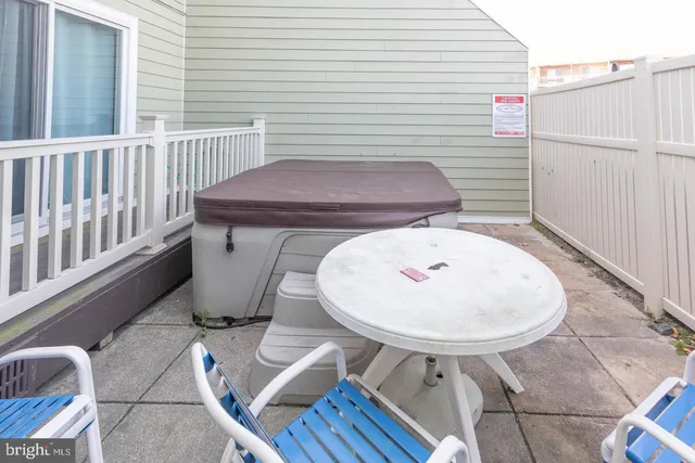 a view of a chair and table in the balcony