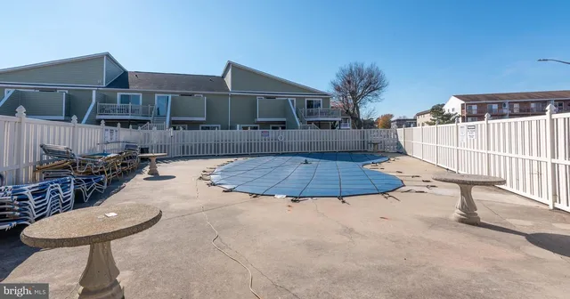 a view of a backyard with sitting area