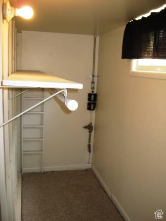 642 East 700 North Logan, UT 84321 - Photo 31 of 33 Walk in closet featuring dark carpet