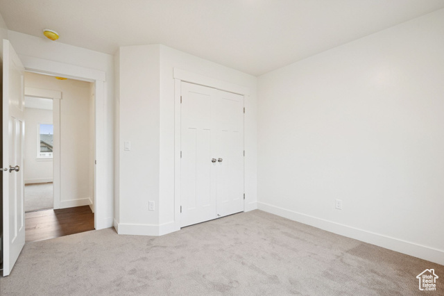 1615 North Angel Street, Unit F Layton, UT 84041 - Photo 12 of 45 Unfurnished bedroom with carpet floors and a closet
