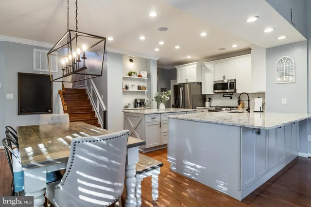 a kitchen with kitchen island granite countertop lots of counter top space