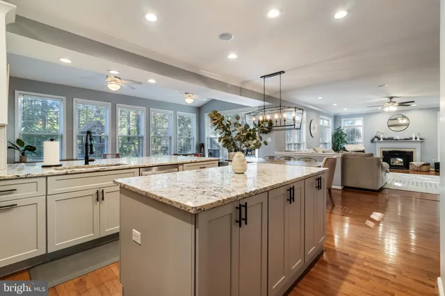 a kitchen with a sink and center island