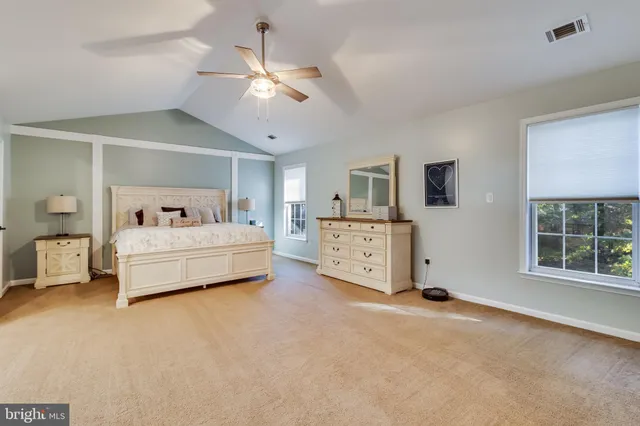 a bedroom with furniture and window