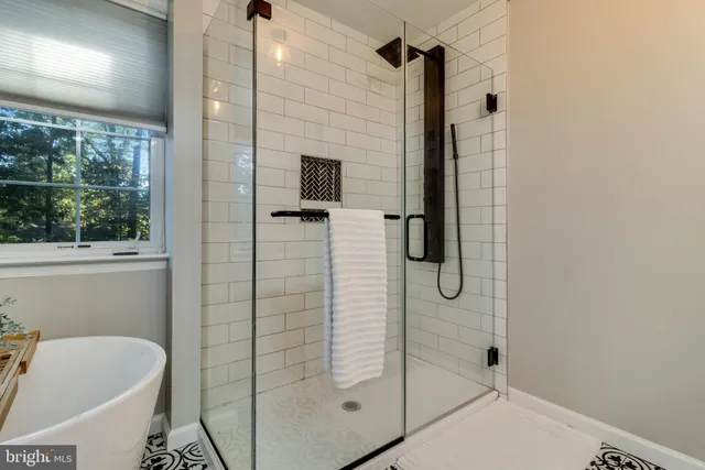 a bathroom with a shower and a toilet