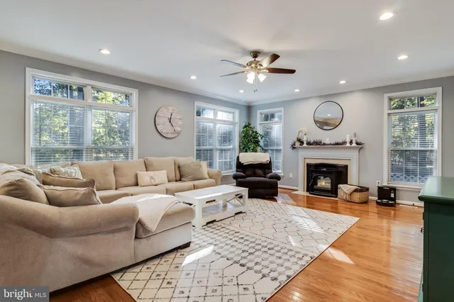 a living room with furniture fireplace and window