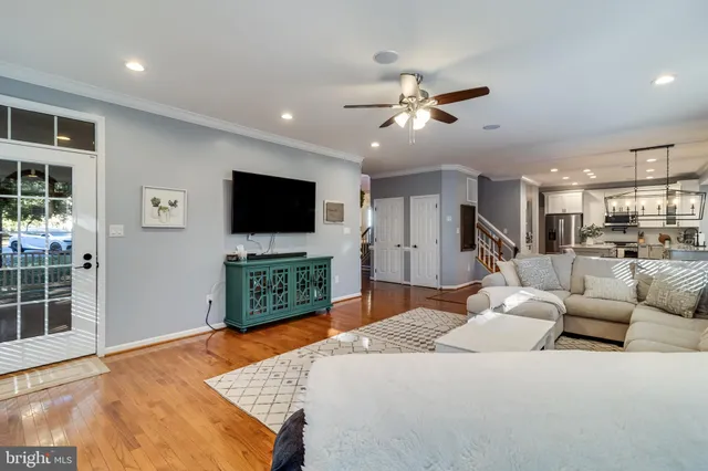 a bedroom with furniture and a flat screen tv
