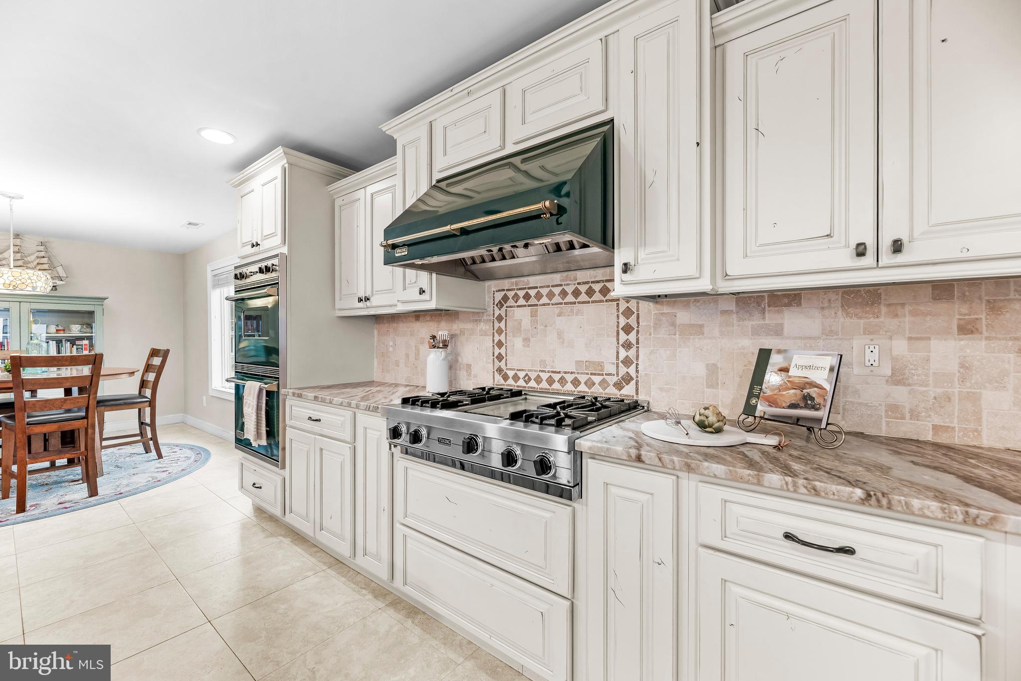 3095 Calvert Boulevard Lusby, MD 20657 - Photo 13 of 105 a kitchen with stainless steel appliances granite countertop a stove and a white cabinets