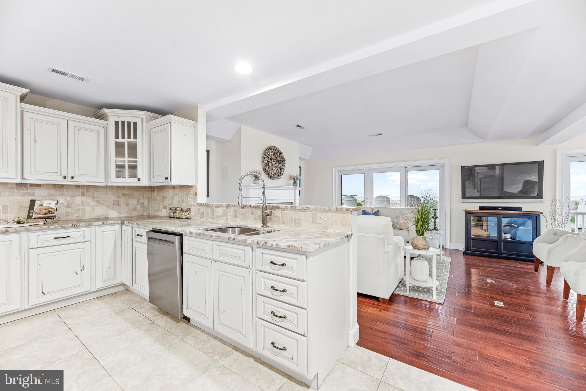 3095 Calvert Boulevard Lusby, MD 20657 - Photo 16 of 105 a kitchen with a sink and cabinets