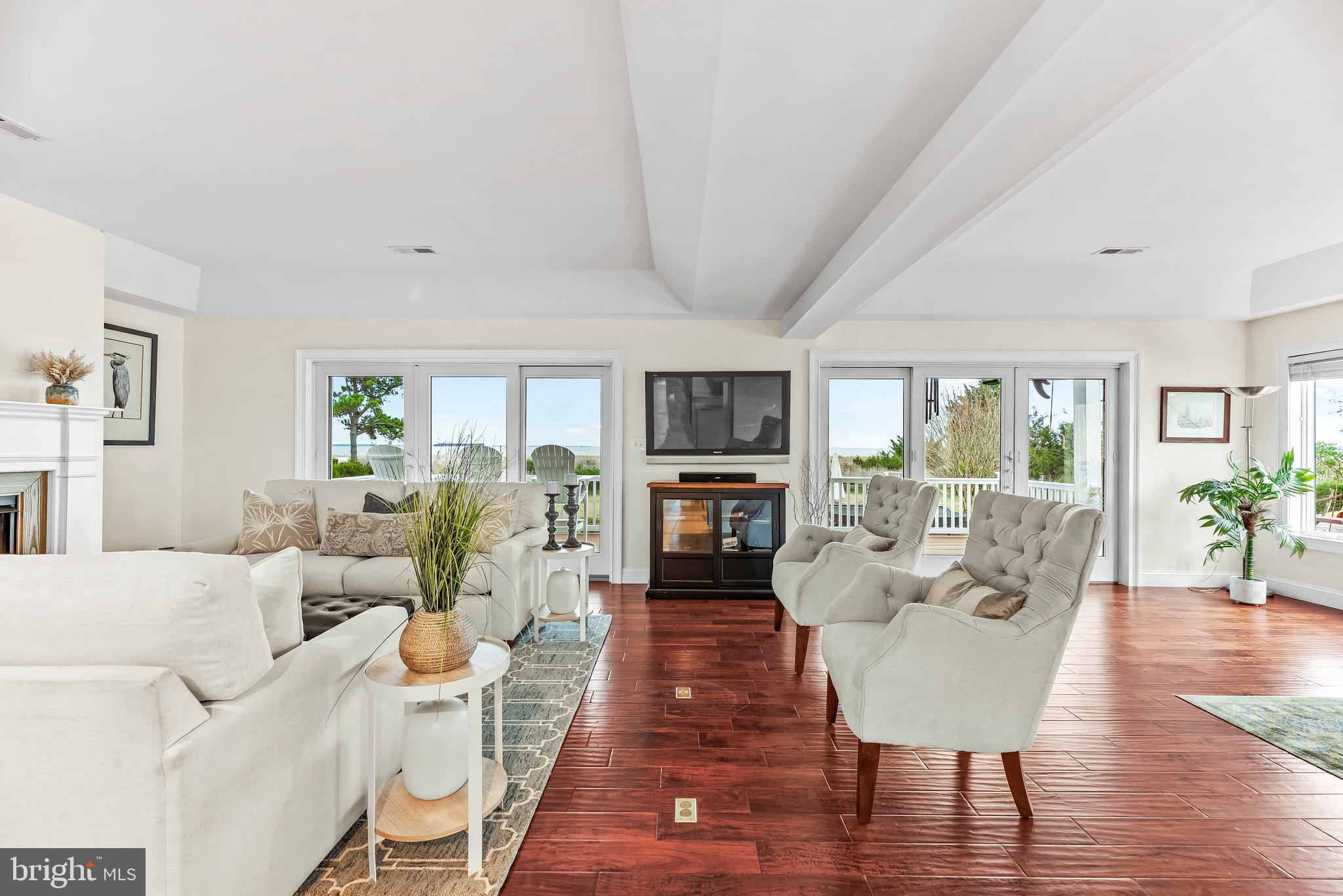 3095 Calvert Boulevard Lusby, MD 20657 - Photo 17 of 105 Step into the living room with gas fireplace.