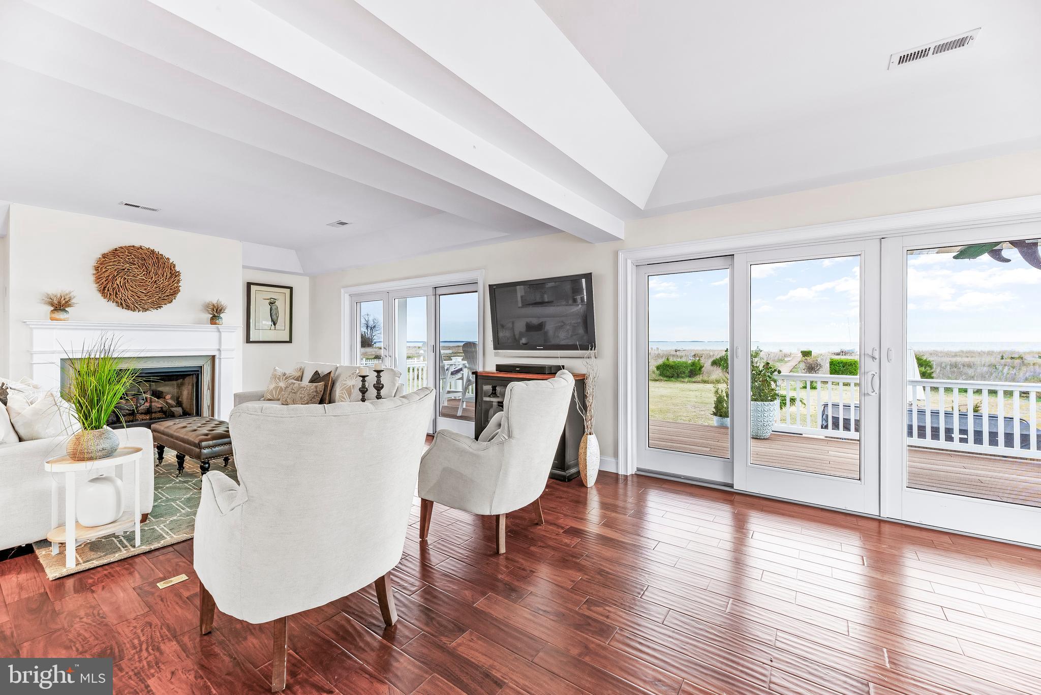 3095 Calvert Boulevard Lusby, MD 20657 - Photo 21 of 105 a living room with fireplace furniture and a wooden floor