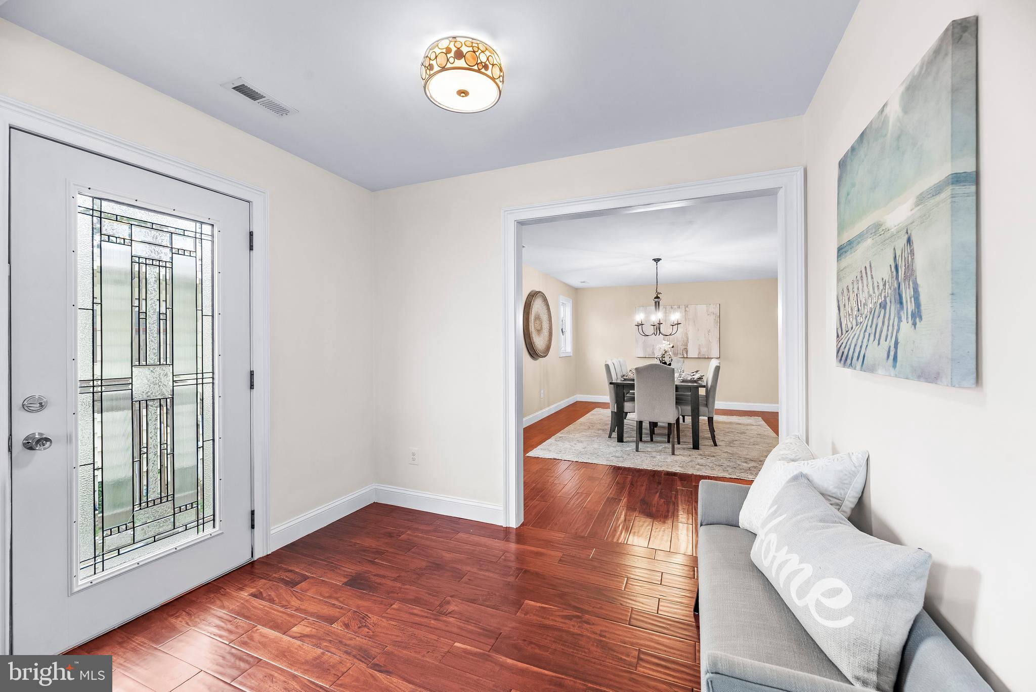 3095 Calvert Boulevard Lusby, MD 20657 - Photo 26 of 105 Tucked away a side entrance with charming bench.