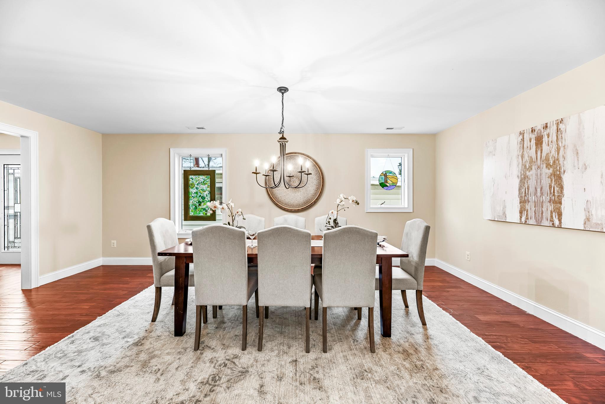 3095 Calvert Boulevard Lusby, MD 20657 - Photo 28 of 105 a view of a dining room with furniture window and wooden floor