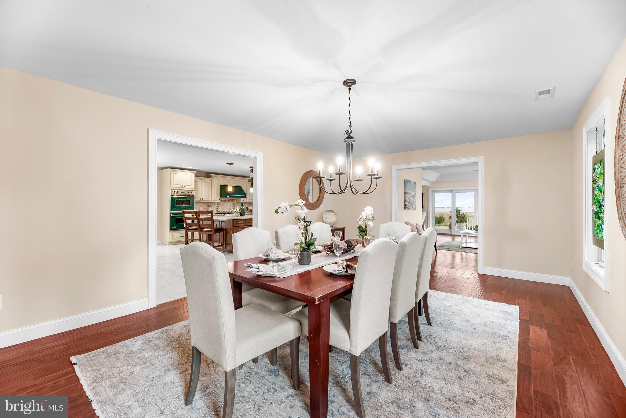 3095 Calvert Boulevard Lusby, MD 20657 - Photo 30 of 105 a view of a dining room with furniture window and wooden floor