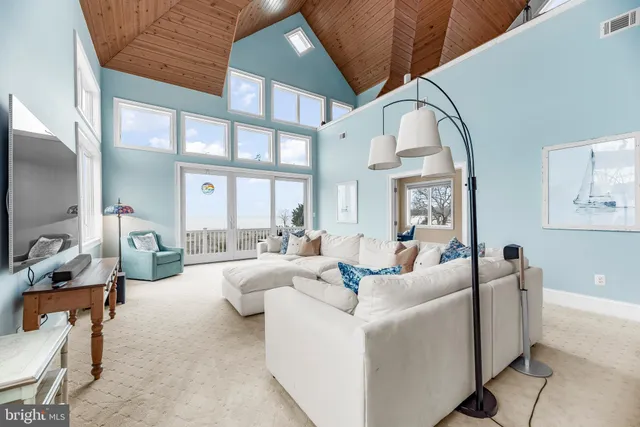 a living room with furniture and flat screen tv