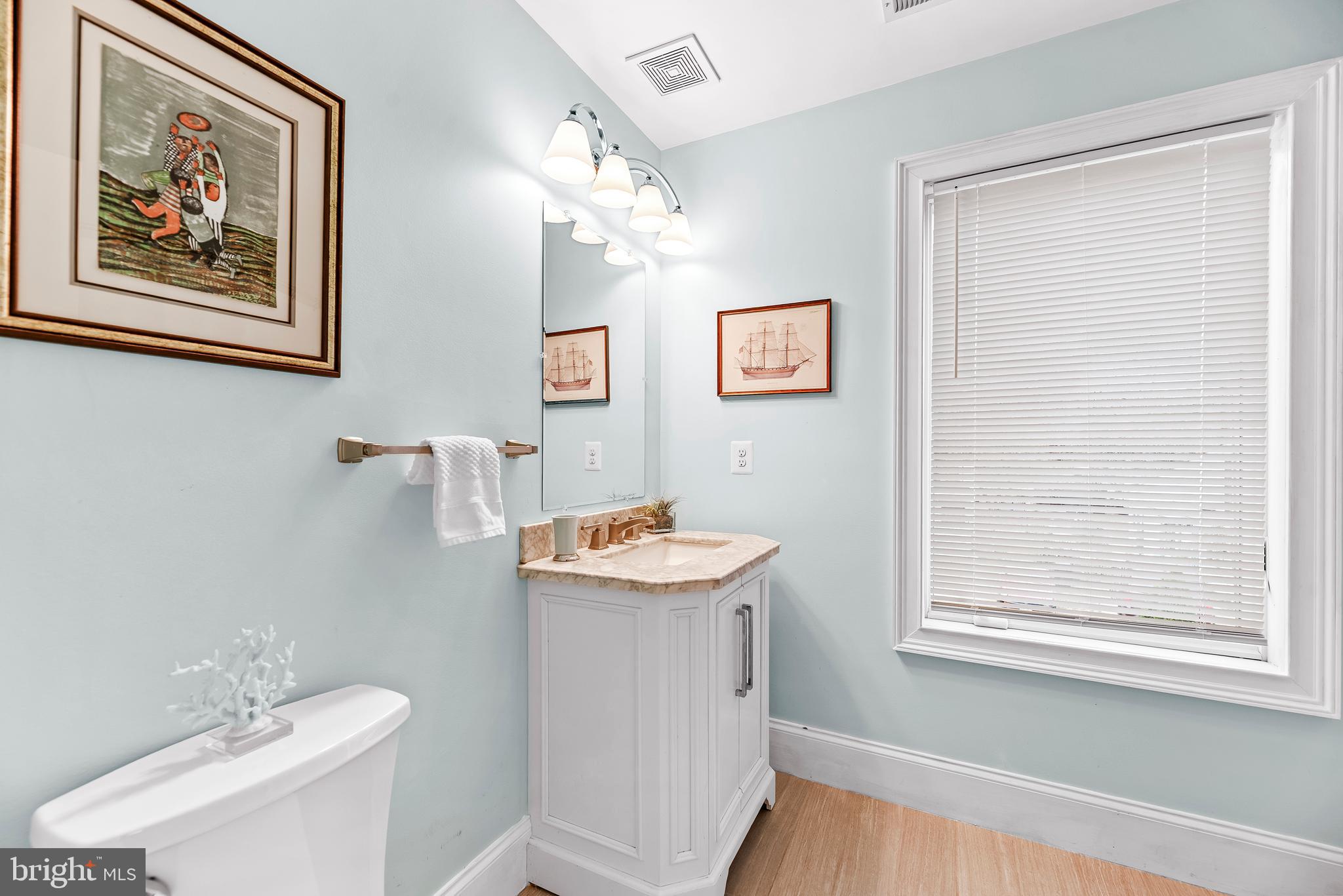 3095 Calvert Boulevard Lusby, MD 20657 - Photo 54 of 105 a bathroom with a sink mirror and a toilet