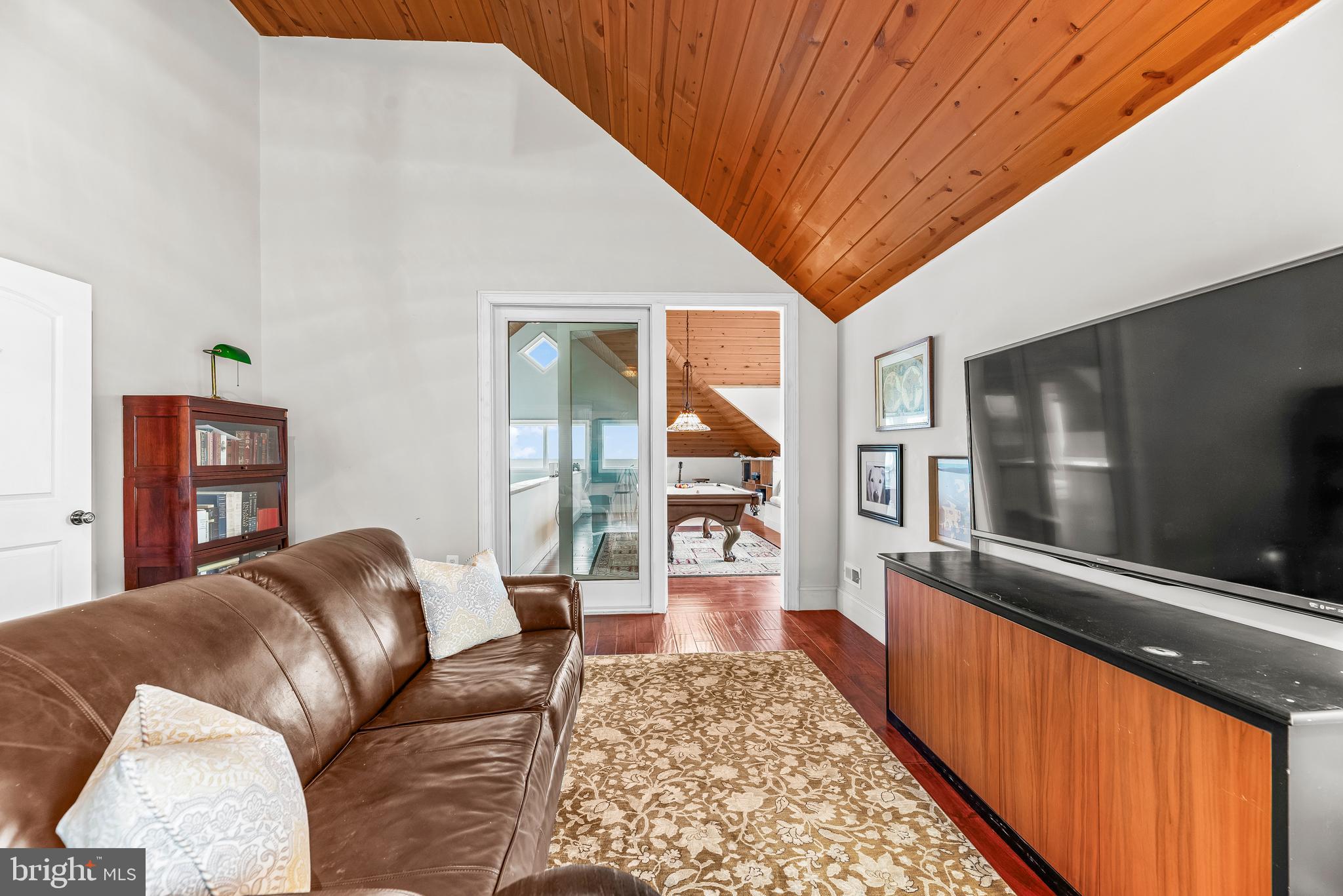 3095 Calvert Boulevard Lusby, MD 20657 - Photo 63 of 105 a living room with furniture and a flat screen tv