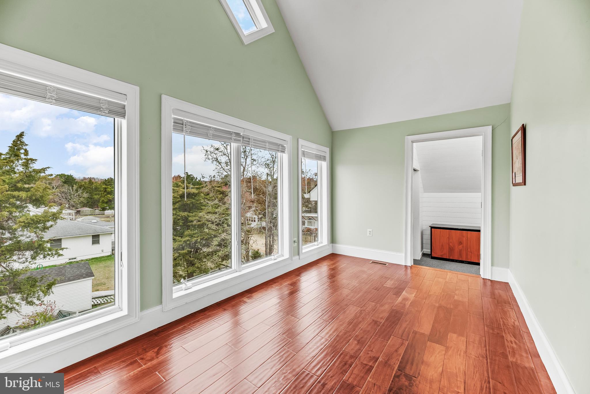 3095 Calvert Boulevard Lusby, MD 20657 - Photo 64 of 105 wooden floor in an empty room with a window