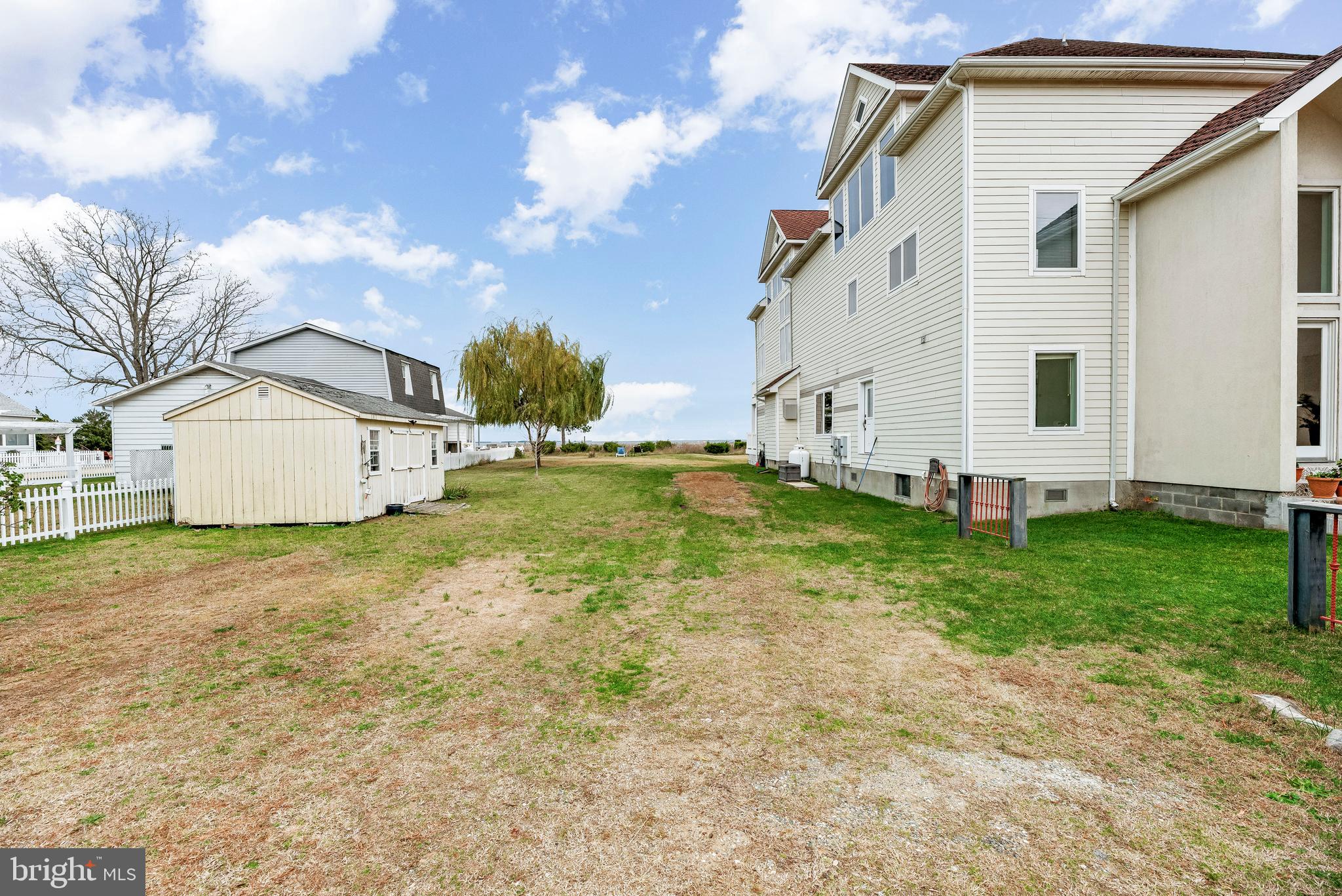 3095 Calvert Boulevard Lusby, MD 20657 - Photo 84 of 105 a view of a backyard with plants and large tree