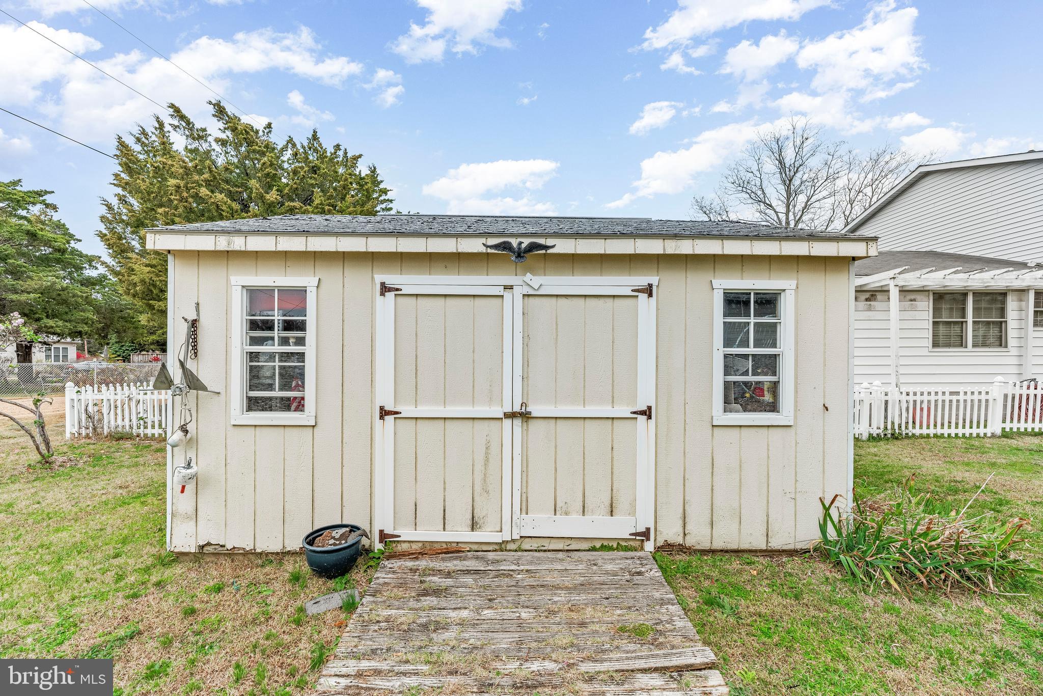 3095 Calvert Boulevard Lusby, MD 20657 - Photo 85 of 105 a view of a house with backyard and sitting area