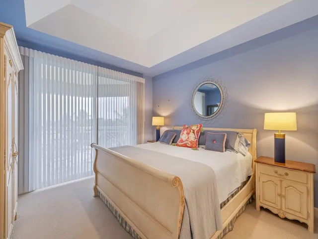 a bedroom with a bed and lamp