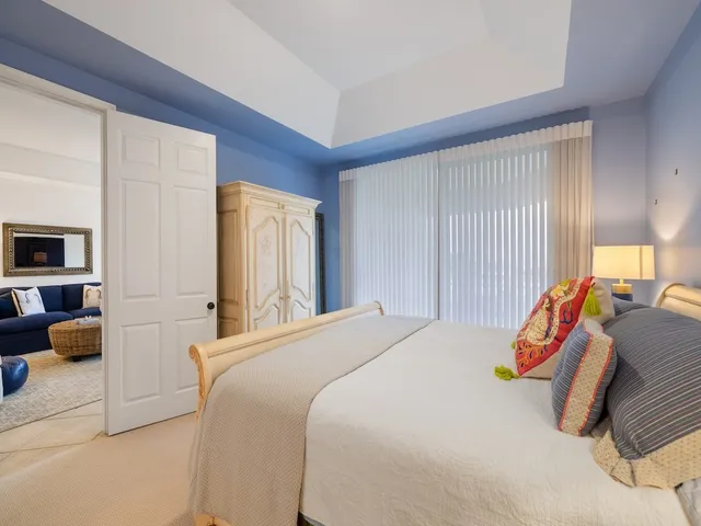 a bedroom with a bed and a walk in closet