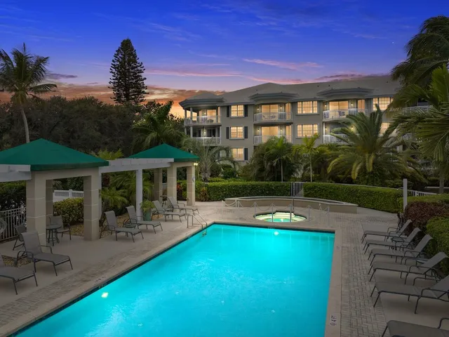 a view of a house with swimming pool and porch