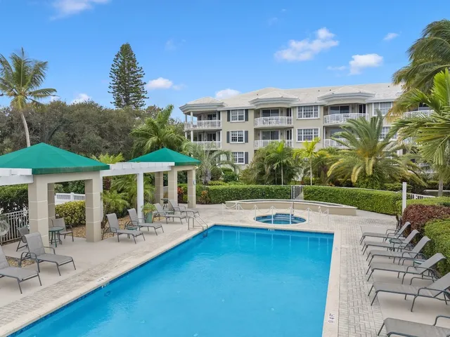 a view of a swimming pool with a lounge chairs
