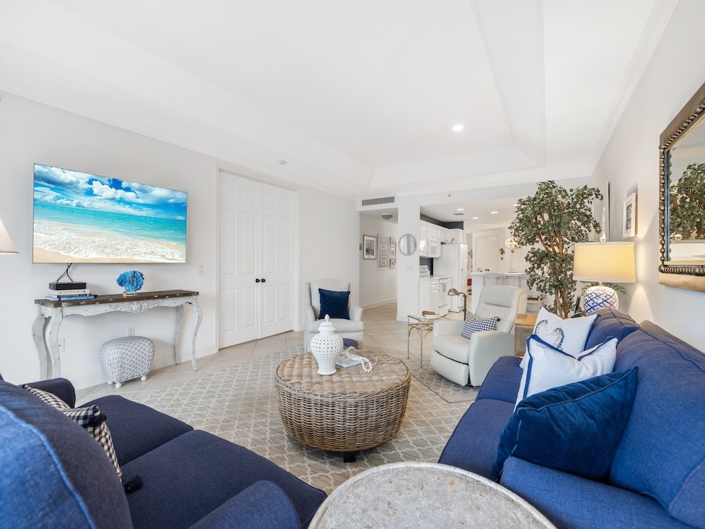 940 Turtle Cove Lane, Unit 302 Vero Beach, FL 32963 - Photo 6 of 30 a living room with furniture and a large window