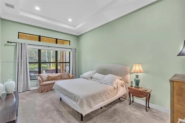 a front view of a house with a garden and yard