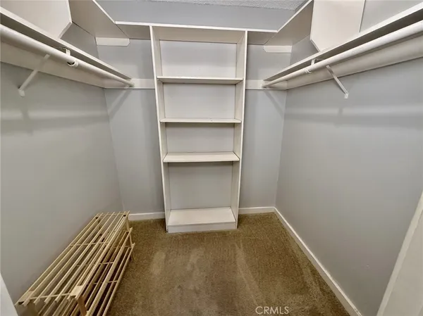 a view of an empty walk in closet